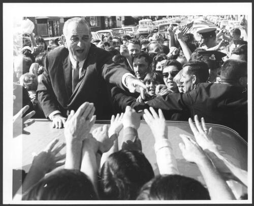 U.S. President Lyndon Baines Johnson greets the crowd during his visit to Australia, 20-22 October 1966, [1] [picture] / [John Mulligan?]