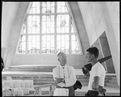Bishop John Patrick O'Loughlin MSC, CMG, Bishop of Darwin chatting with an unidentified man in the church building, Northern Territory, 1 May 1962] [picture] / John Mulligan