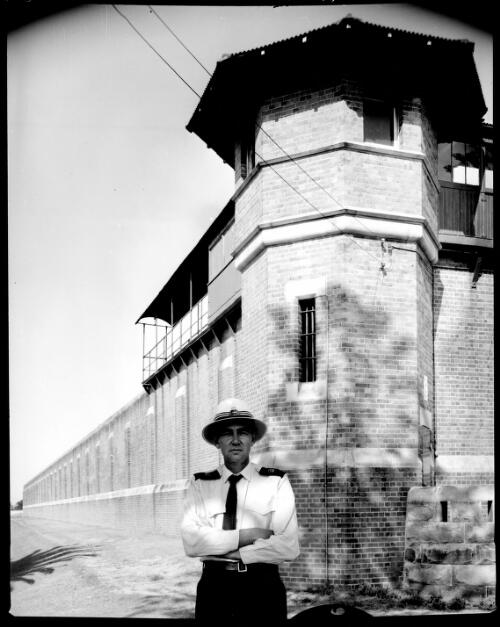 Ted Kennedy, Chief Nurse-Chemist of the New South Wales Prisons Department, outside the New South Wales State Penitentiary, 1963-1964 [picture] / John Mulligan