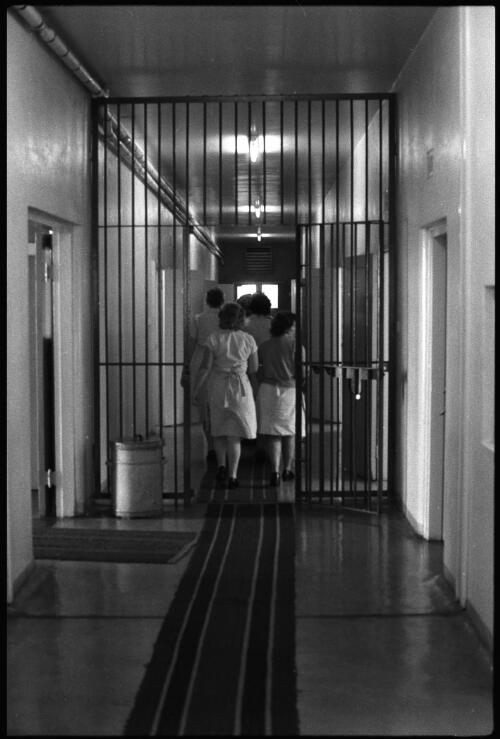 Prisoners in single file walking down corridor at the State Reformatory for Women, Long Bay, Sydney [2] [picture] / John Mulligan