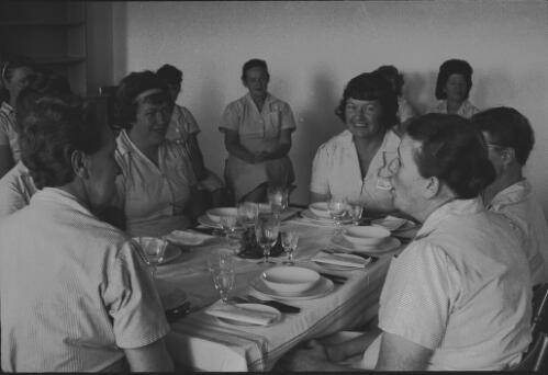 Group of prisoners seated at formal dining table, State Reformatory for Women, Long Bay, Sydney [3] [picture] / John Mulligan