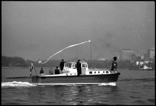 Police launch Nemesis cruising on Sydney Harbour with unidentified piper in bow, 6 June 1966 [2] [picture] / John Mulligan