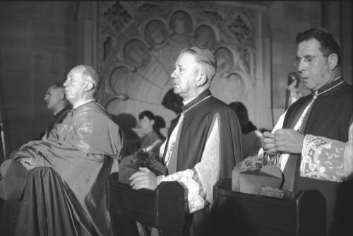 Cardinal Gilroy (on left) with Archbishop James Carroll and Bishop Thomas Muldoon in prayer at St. Mary's Cathedral during a Mass celebrating St. Patrick's Day and the silver jubilee of Cardinal Gilroy's succession to the See of Sydney, 17 March 1965 [2] [picture] / John Mulligan