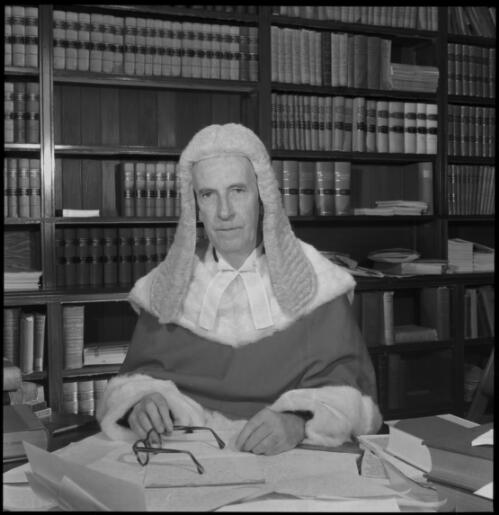 Portrait of Mr Justice Cyril Ambrose Walsh wearing judicial robes and wig seated in chambers, 20 May 1965 [2] [picture] / John Mulligan