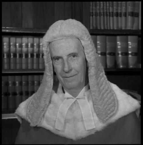 Portrait of Mr Justice Cyril Ambrose Walsh wearing judicial robes and wig seated in chambers, 20 May 1965 [3] [picture] / John Mulligan