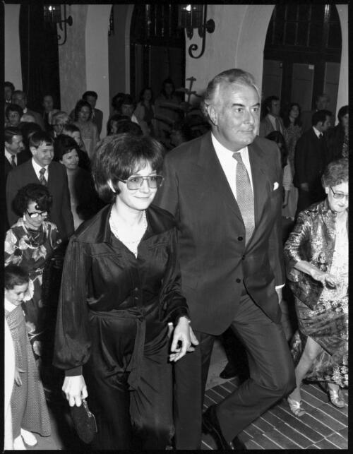 Gough Whitlam ascending stairs with unidentified woman at the opening of Roxy Theatre, Hoyts, George Street, Parramatta, 1976 [picture] / John Mulligan