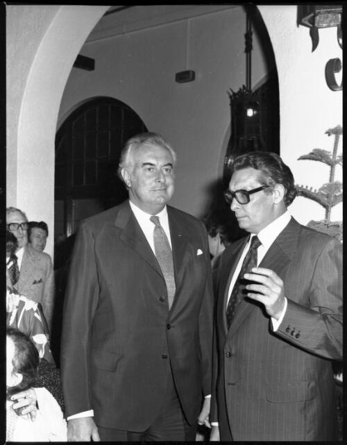 Gough Whitlam in conversation with unidentified man at the opening of Roxy Theatre, Hoyts, George Street, Parramatta, 1976 [picture] / John Mulligan