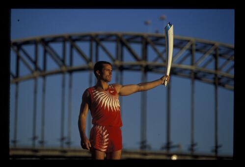 The 2000 Sydney Olympic Games Torch with the Sydney Harbour Bridge as a backdrop, 23 March 1999 [picture] / Allsport
