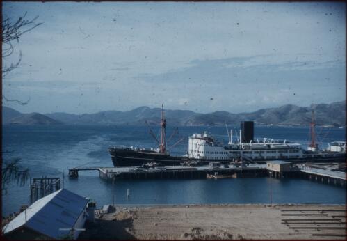 The wharf and Changsha at Port Moresby harbour. A warehouse stands on the left Port Moresby, Papua New Guinea, 1953 [picture] / Terence and Margaret Spencer