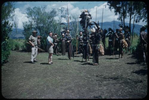 We pause, waiting for the bridegroom: Dr Spencer and Marie Reay in left foreground Wahgi Valley, Papua New Guinea, 1955 [picture] / Terence and Margaret Spencer
