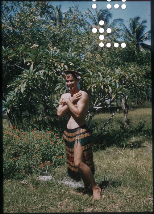 Having fun - Brian McBarron (Agricultural Officer) outside our house Mapamoiwa Station, D'Entrecasteaux Islands, Papua New Guinea, 1956-1959 [picture] / Terence and Margaret Spencer