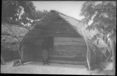 House with man standing inside Carteret Islands, Papua New Guinea, 1960 [picture] / Terence and Margaret Spencer