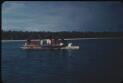 A canoe approaching the main island of the atoll (1) Mortlock Islands, Papua New Guinea, 1960 [picture] / Terence and Margaret Spencer