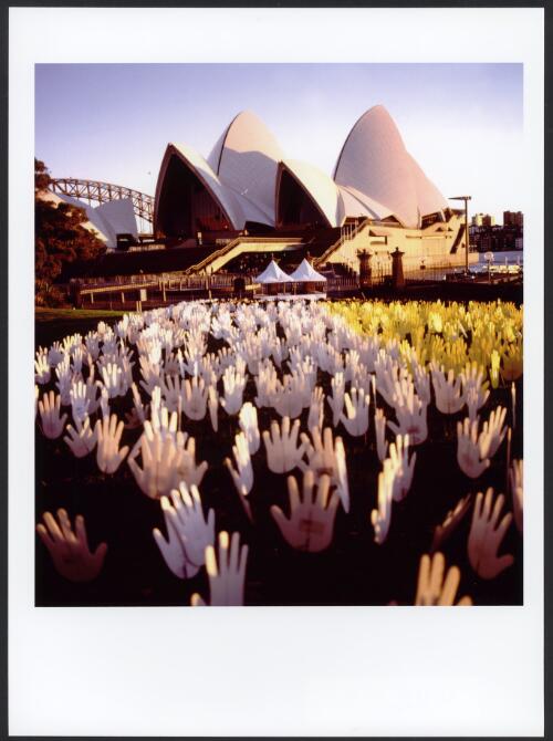 Sea of Hands with the Sydney Opera House in the background during Corroboree 2000 [picture] / Loui Seselja