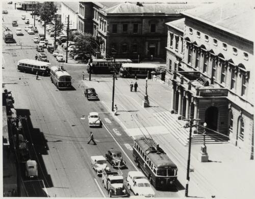 Hobart B.U.T. trolley buses, AEC half cab and Bedford bus in Macquarie Street, Hobart, near Argyle Street, ca. 1953 [picture]