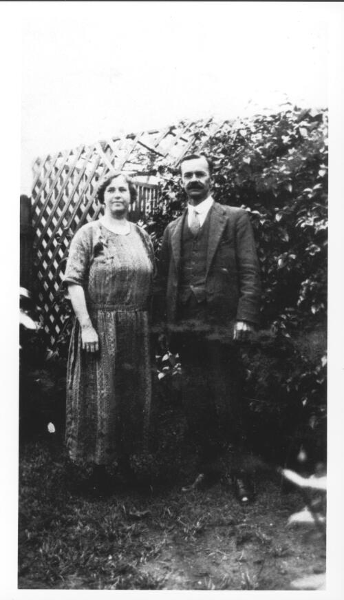 [Portrait of a man and woman standing in a garden, Anderson family] [picture]