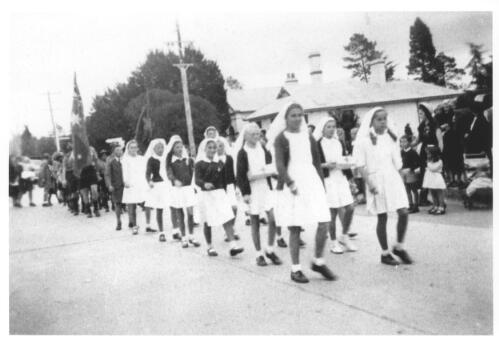 [Children marching in an Anzac Day march in Queanbeyan, New South Wales, 1948] [picture]