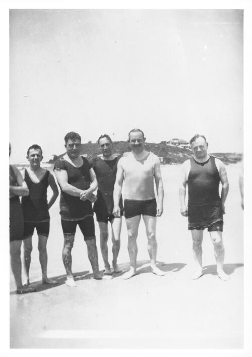 [Portrait of Leopold Amery, Secretary of State for Dominion Affairs, with several men on a beach during his visit to Australia, 1927-1928] [picture]