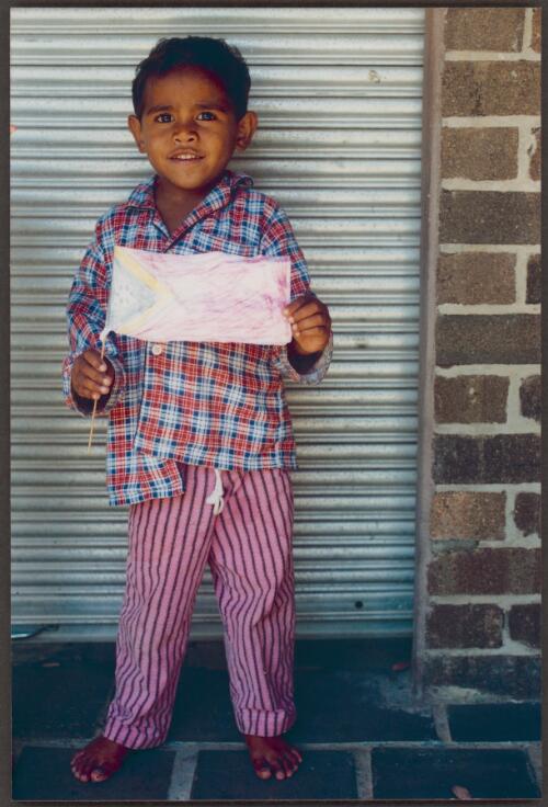 [East Timorese child holding a flag, East Hill Safe Haven, Sydney, 1999] [picture] / Penelope Iredell