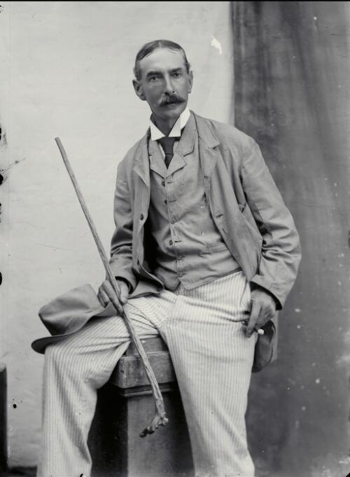 [Portrait of unidentified man with moustache, wearing suit and holding walking cane and cigar, New South Wales, 2] [picture] / Robert Morse Withycombe