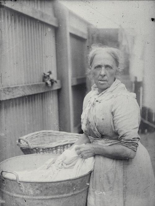 [Portrait of unidentified laundress washing clothes in a galvanised iron tub, New South Wales, ca. 1890s] [picture] / Robert Morse Withycombe
