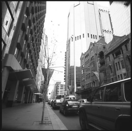 [Olympic Arts Festival flags at Johnson's Corner and the Brooklyn Hotel on the corner of George and Grosvenor streets, Social aspects, Sydney Olympic Streetscape Displays, 18 August 2000] [picture] / Loui Seselja
