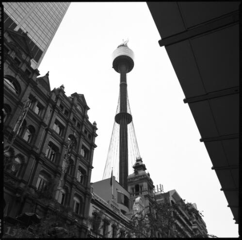 [Sydney Tower showing one of the three sculptures on its roof with an Olympic theme, Sydney, 18 August 2000] [picture] / Loui Seselja