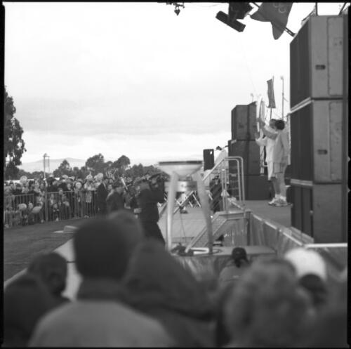 Torch bearer on stage, New Parliament House, Canberra, 5 September 2000 [picture] / Loui Seselja