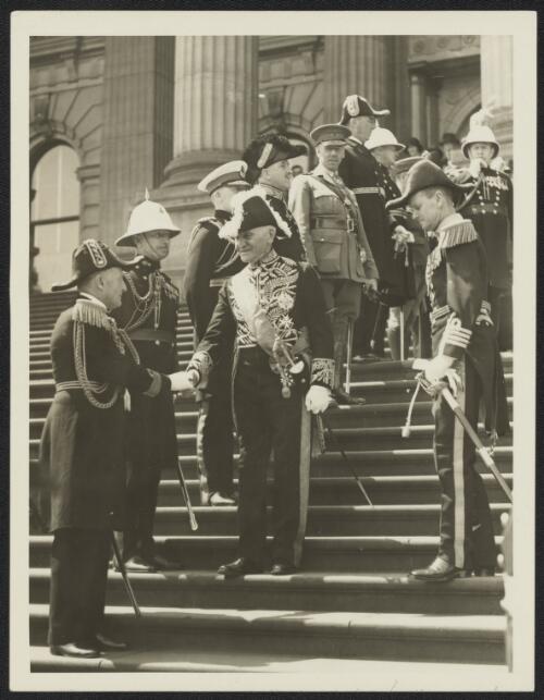 Governor-General Sir Isaac Isaacs shaking hands with a Navy Commander following the Investiture, Melbourne, Victoria, 1933 [picture]
