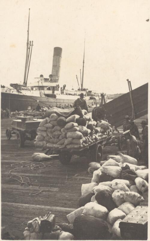Kit bags [to be loaded on trooper ship, Port Melbourne, Vic., Feb. 1915] [picture] / J.P. Campbell