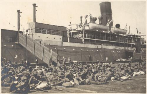 At Port Melbourne [where the troops and their gear rest alongside the Star of Victoria, Feb. 1915] [picture] / J.P. Campbell