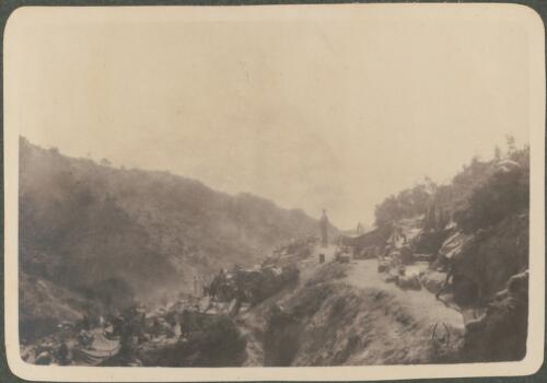 Morning camp scene, [Anzac soldiers camped along the side of a ravine trail, June? 1915] [picture] / J.P. Campbell