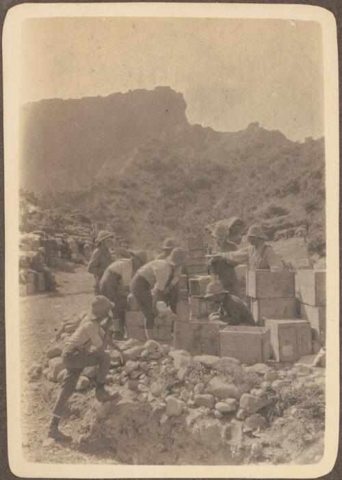 [Anzac soldiers, camped near the trenches, unpack boxes of supplies, June? 1915] [picture] / J.P. Campbell