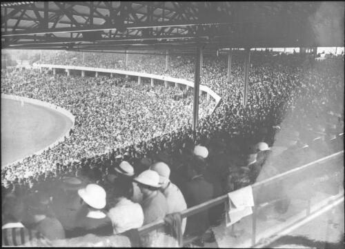 Full crowd in grandstand at the third Test, Melbourne Cricket Ground, 1936/37 Marylebone Cricket Club (MCC) tour of Australia [transparency]