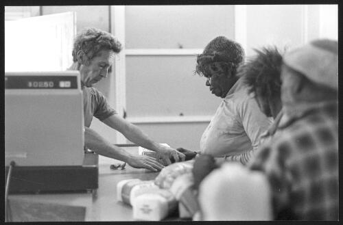 Aboriginal woman buying tea and sugar, Jigalong, Pilbara, W.A. October 1979 [picture] / Lyn McLeavy