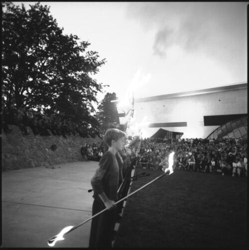 [Members of Warehouse Circus perform fire juggling and fire twirling during the Sunrise Ceremony at the National Museum of Australia, Canberra, 10 March 2001] [picture] / Loui Seselja