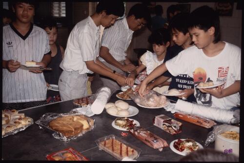 Children helping themselves with desserts, [Darwin, 1990] [picture] / William Yang