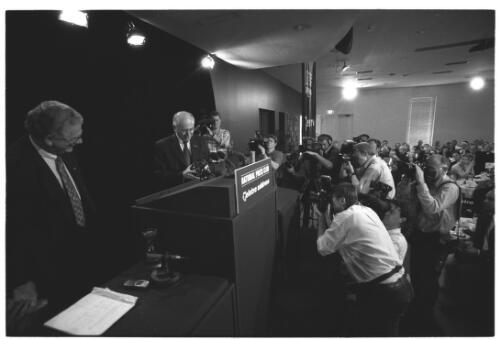 [Portrait of John Howard and press photographers at the National Press Club, Canberra, 8 November 2001] [picture] / Loui Seselja