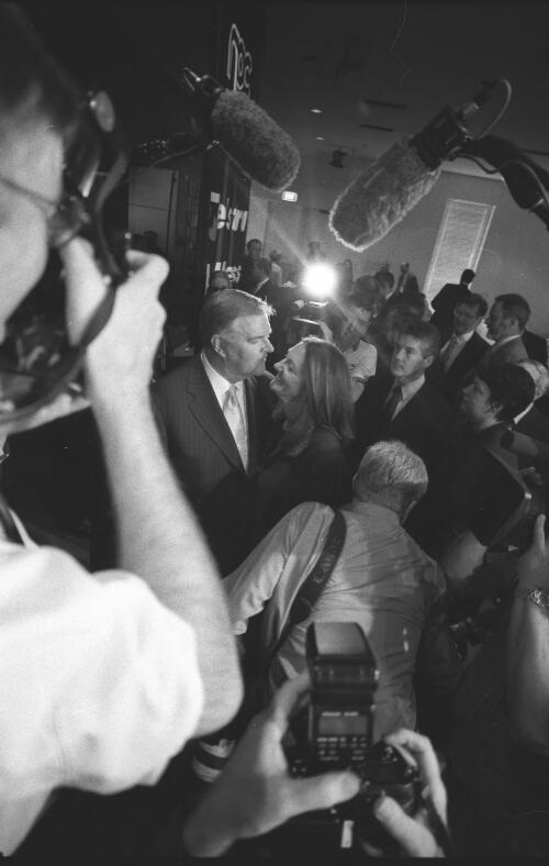 [Portrait of Kim Beazley and his wife, Susie Annus, with members of the press, National Press Club, Canberra, 8 November 2001] [picture] / Loui Seselja