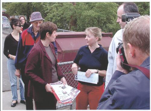 [Anna Burke, Federal member for Chisholm, handing out how to vote leaflets outside polling booth on election day, Melbourne, Saturday, 10 November 2001] [picture] / Francis Reiss