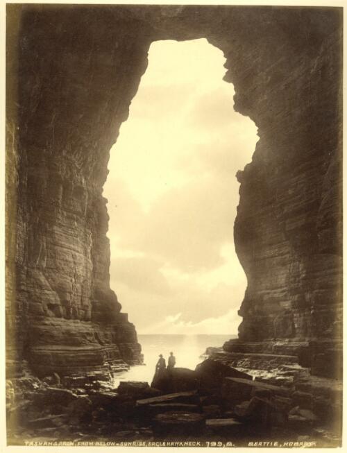 Tasman's Arch, from below - sunrise, Eaglehawk Neck [Tasmania] [picture] / J. W. Beattie