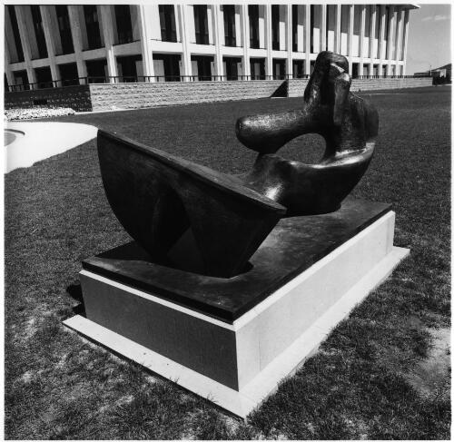 Henry Moore's sculpture "Two piece reclining figure no. 9" (1969) outside the Australian National Library, Canberra, 1970 [picture] / National Capital Development Commission