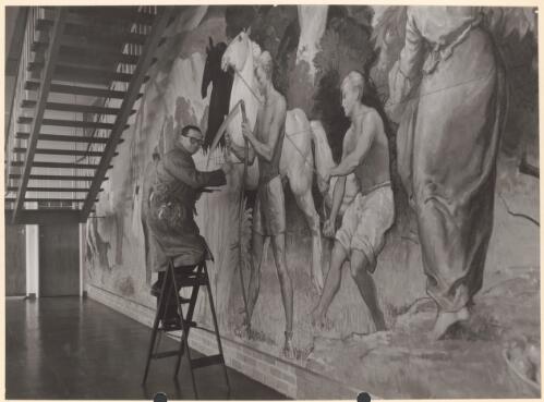 Portrait of William Dargie, noted Australian artist, putting the finishing touches to a large mural, 1954 [picture] / Australian official photograph by Cliff Bottomley