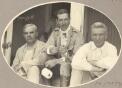 On the verandah of the Katherine Telegraph Station, Minister Thomas, Sir Walter Barttelot, Dr Gilruth [picture] / J.P. Campbell
