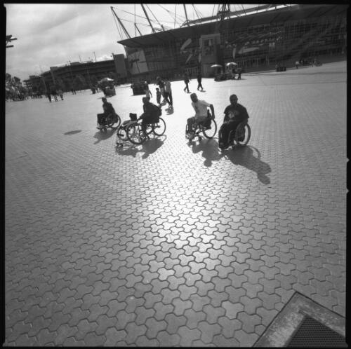 [Wheelchair athletes outside Olympic Stadium, Sydney 2000 Paralympic Games, 22 October 2000] [picture] / Louis Seselja