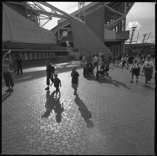 [Boccia competitors and spectators outside Olympic Stadium, Sydney 2000 Paralympic Games, 22 October 2000] [picture] / Louis Seselja