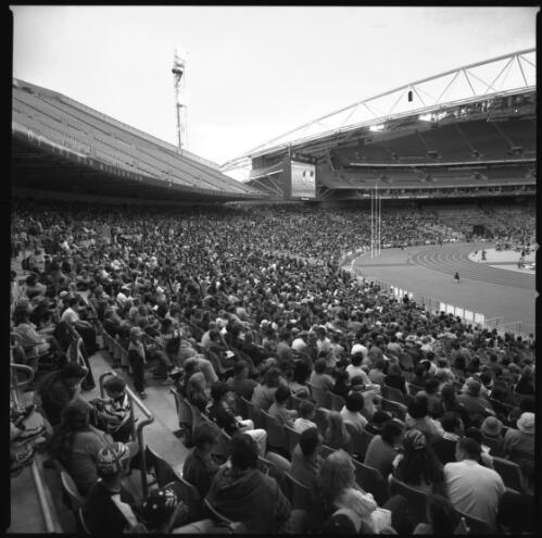 [Large crowd watching the events in progress in the Olympic Stadium, Sydney Olympic Park, Sydney 2000 Paralympic Games, 22 October 2000] [picture] / Louis Seselja