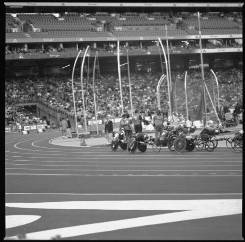 [Track event, men's wheelchair class, Olympic Stadium, Sydney 2000 Paralympic Games, 22 October 2000] [picture] / Louis Seselja