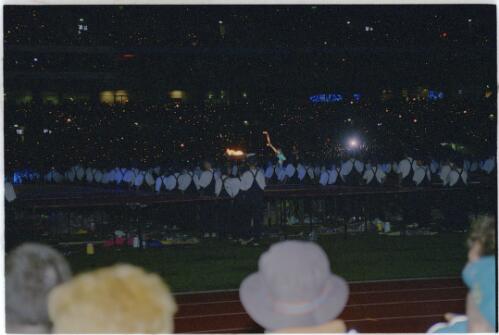 The Paralympic flame being lit by the Paralympic Torch, Stadium Australia, 18 October 2000 [picture] / Jim Nomarhas