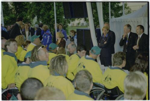 John Howard talking to Libby Kosmala [at the Australian team welcome ceremony,  Amphitheatre, Paralympic Village, 15 October 2000, 2] [picture] / Jim Nomarhas